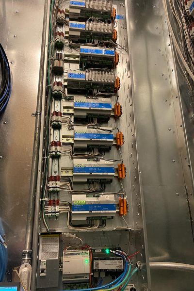 Close-up view of a detailed electrical control panel with numerous circuits and wires.